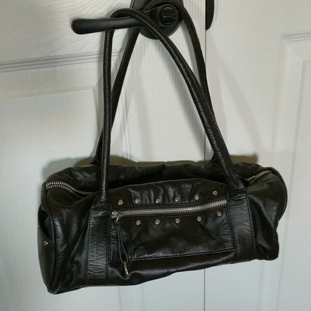 Gently used dark brown leather bag.